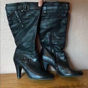 Black leather high heel boots.